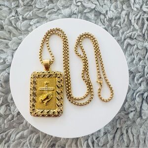 Gold Pendant Necklace with Cross and Heart Design